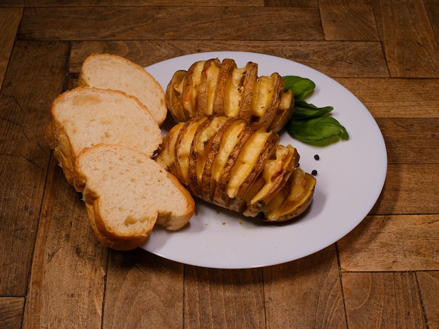 Baked potatoes with lard on a plate