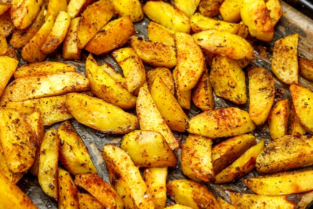 Baked potatoes with spices and salt baking sheet