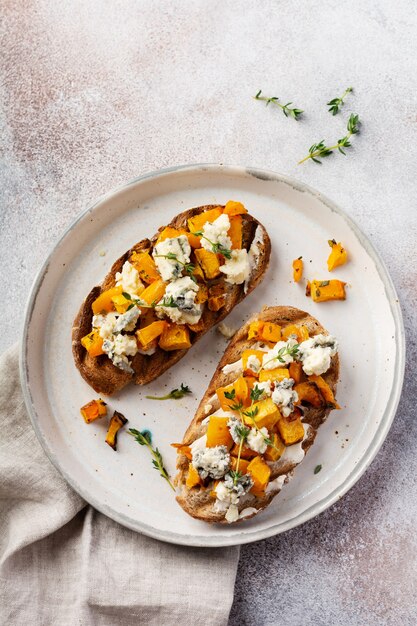 Baked pumpkin sandwich with dorblu cheese with blue mold