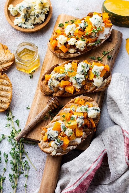 Baked pumpkin sandwich with dorblu cheese with blue mold