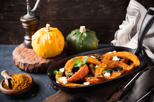 Baked pumpkin with goat cheese and mint