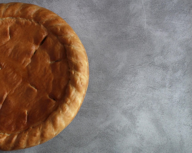 Baked round cake with filling on the background under the concrete view from above side arrangement