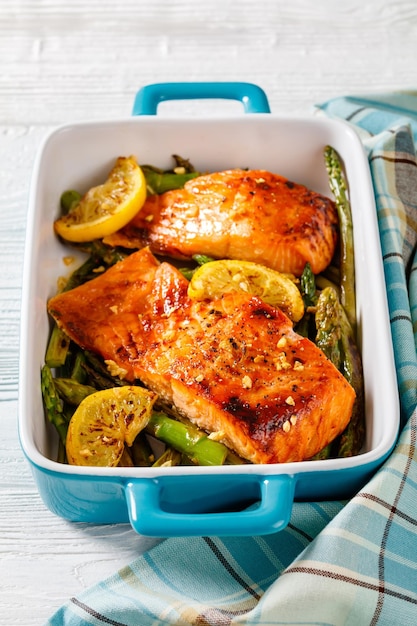 Baked salmon fish fillet with asparagus and lemon