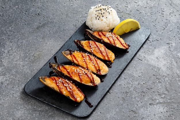 Baked scallops on stone plate