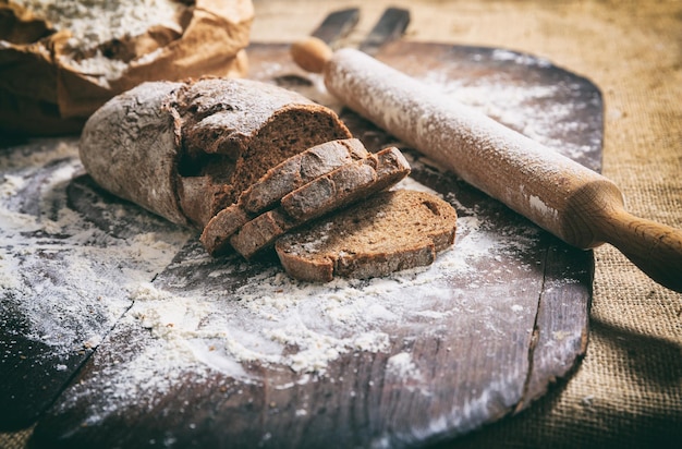 Baked sliced bread on a wooden surface