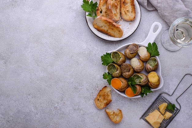 Baked snails escargot with bread