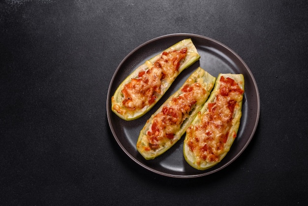 Baked stuffed zucchini boats with minced chicken mushrooms and vegetables with cheese