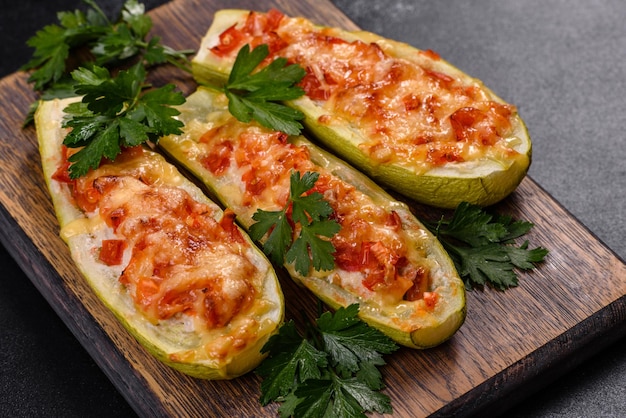 Baked stuffed zucchini boats with minced chicken mushrooms and vegetables with cheese