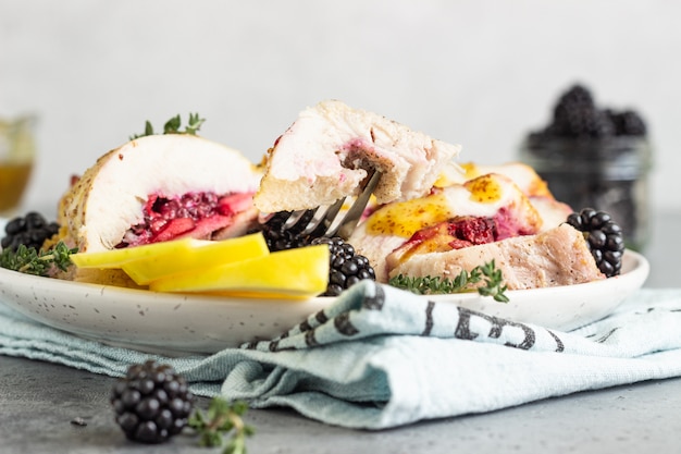 Baked turkey or chicken breast stuffed with apples and blackberries.