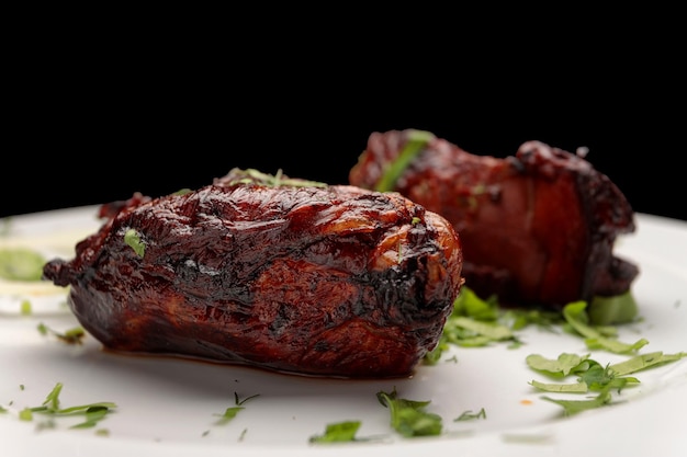 Baked veal liver with herbs on a plate