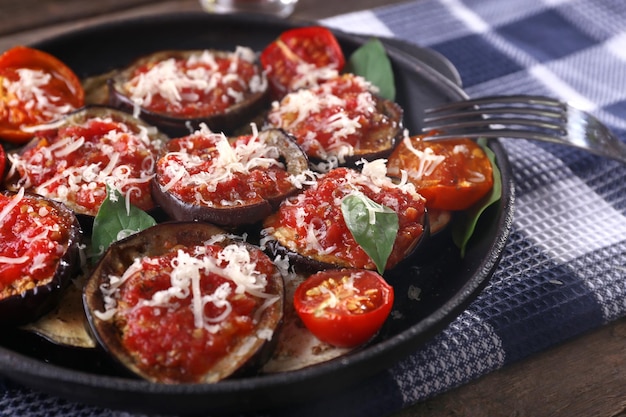 Baked vegetables in pan on table closeup