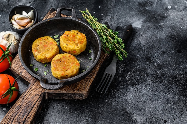 Baked vegetables patties cutlets for vegan burgers. Dark background.