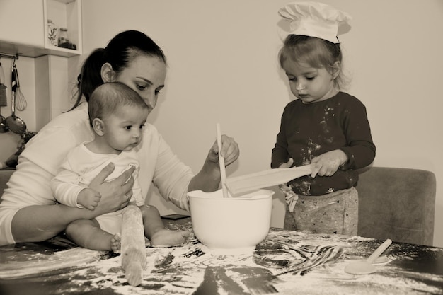 Baker family Mum with two kids in the kitchen