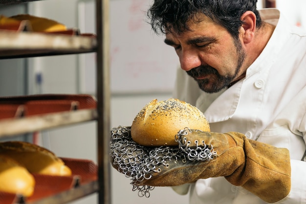 Baker kneading dough in a bakery