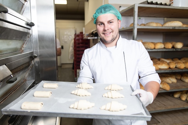 Baker Making Croissant Before Going to the Oven