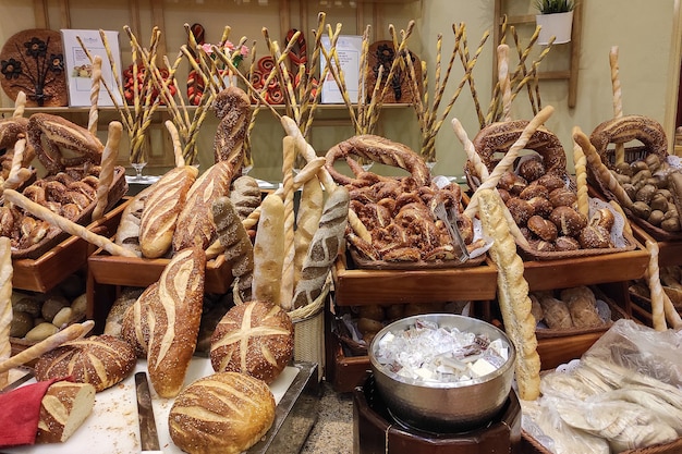 Bakery counter different breads baguettes and other baked goods