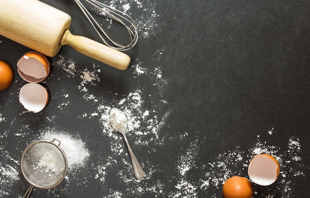 Bakery equipment and ingredient on black granite table