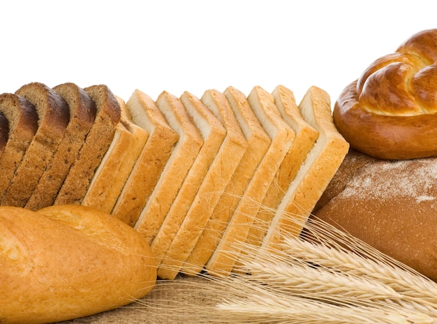 Bakery products and wheat with spike isolated on white background