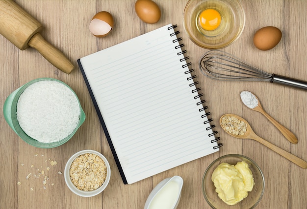 Bakery Tools and notebook on wood