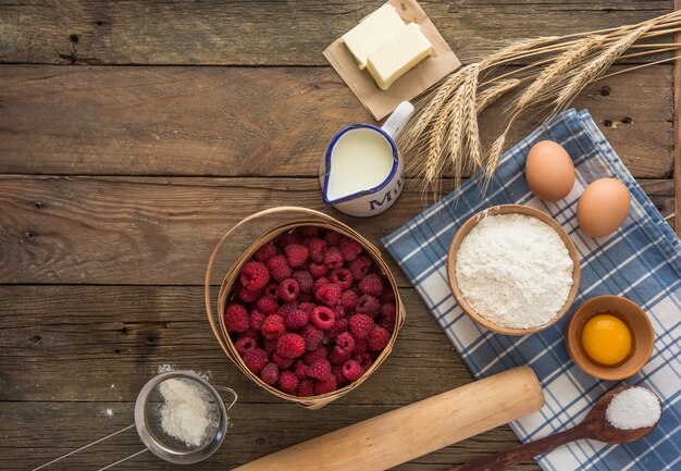 Baking concept, baking ingredients. Ingredients for baking cake, cookies, bread or pastry. Frame of cooking kitchen utensils and food