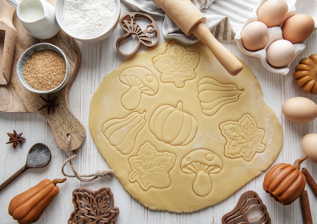 Baking cookies in the form of pumpkin and leaves