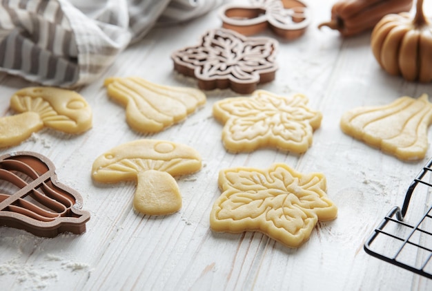 Baking cookies in the form of pumpkin and leaves