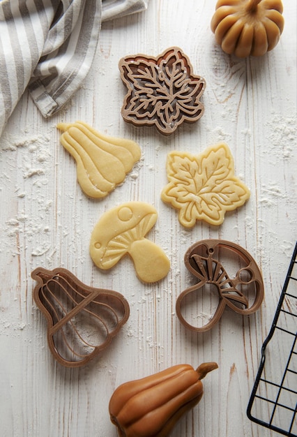 Baking cookies in the form of pumpkin and leaves