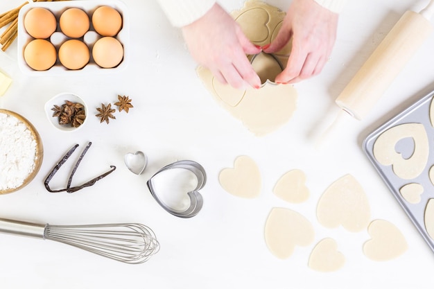 Baking heart shaped sugar cookies for Valentines Day.