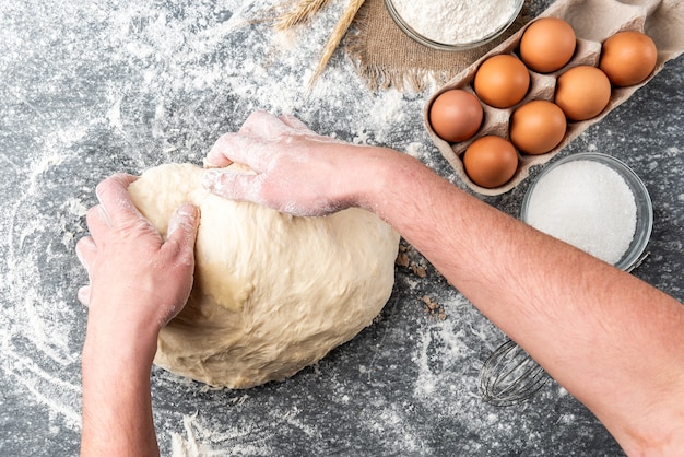 Baking ingredients with pressed yeast, eggs, sugar, milk, and flour