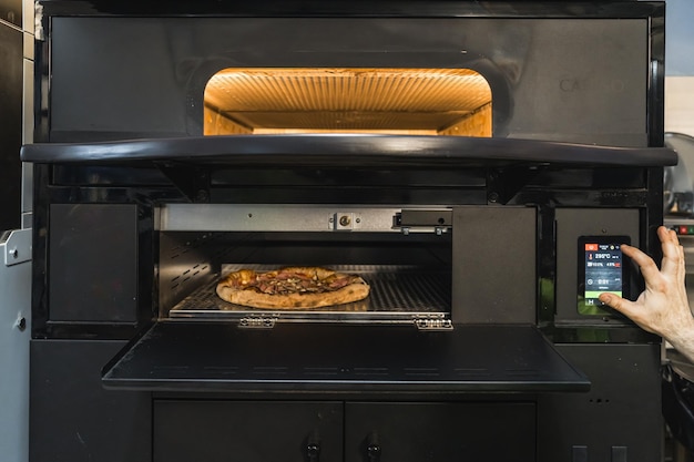 Photo baking italian pizza in an electric oven modern restaurants