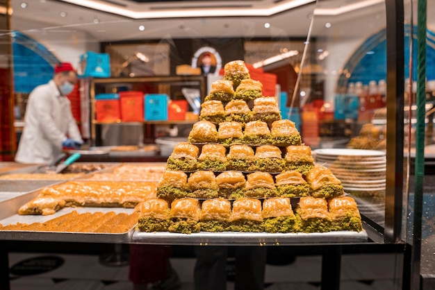 Baklava sweet pastry made of filo filled with chopped nuts display in tray