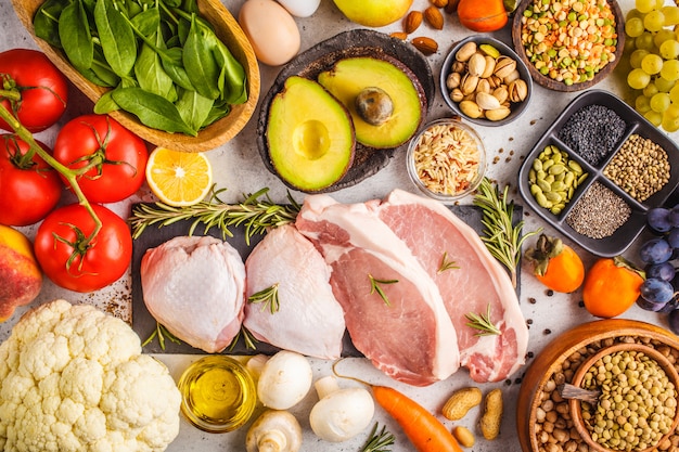 Balanced diet food background. Healthy ingredients on a white background, top view.