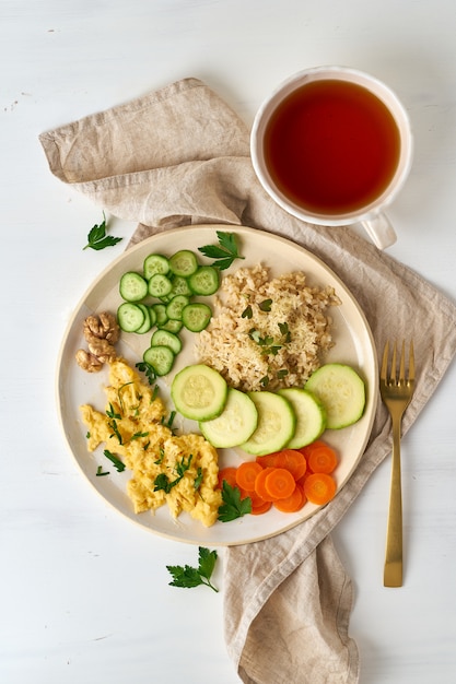 Balanced gluten free food, brown rice & zucchini with scramble, dash fodmap diet, vertical