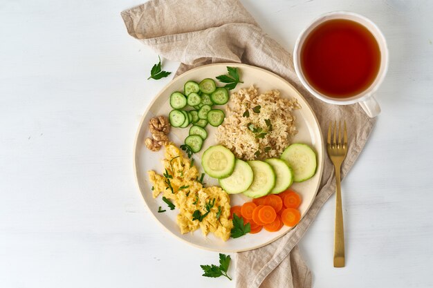 Balanced gluten free food, brown rice & zucchini with scramble