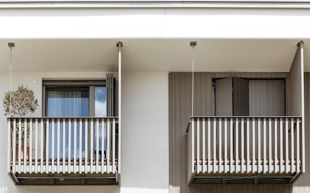 Balcony Shutters. Modern Balcony Door with Protective Shutters. Blinds on Balcony Door