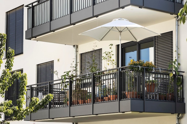 Balcony with Flowers for relax, Facade view. Decorated Modern Balcony Garden, Balcony Shutters.