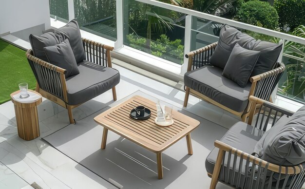 Photo a balcony with a table and chairs with a black bowl on it