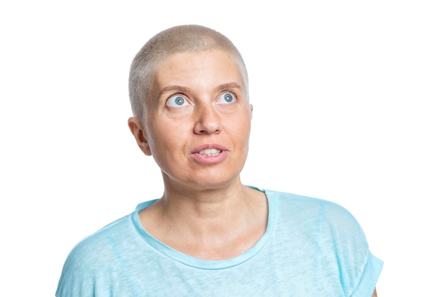 Bald adult woman in a blue tshirt Illness lifestyle and expression of individuality Isolated on white background Closeup