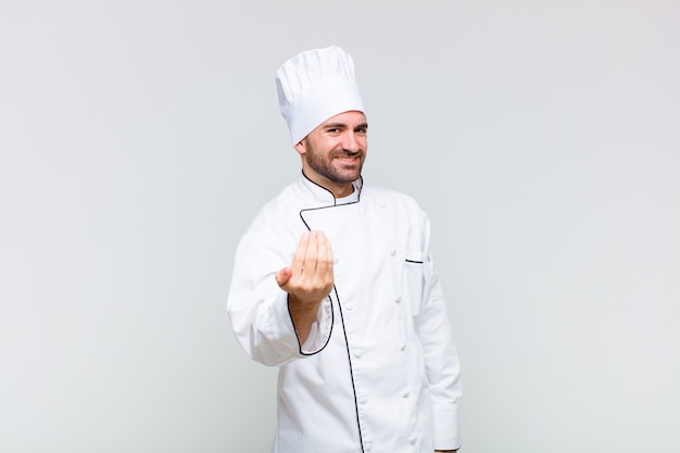 Bald man feeling happy, successful and confident, facing a challenge and saying bring it on! or welcoming you