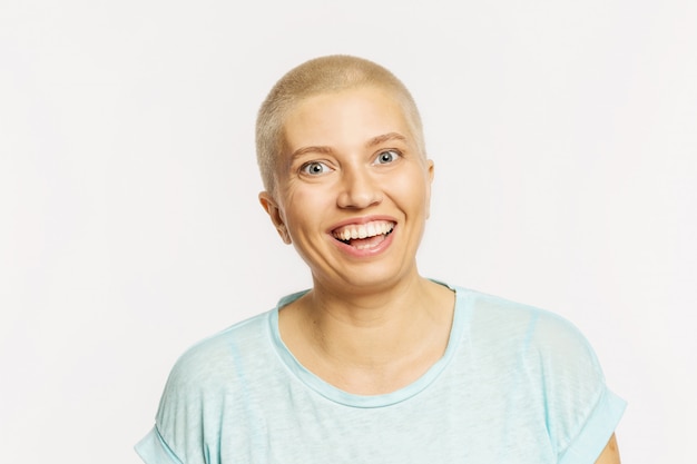 Bald young woman laughing