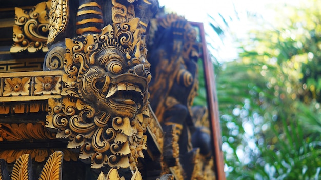 Balinese building with gate guardian statue