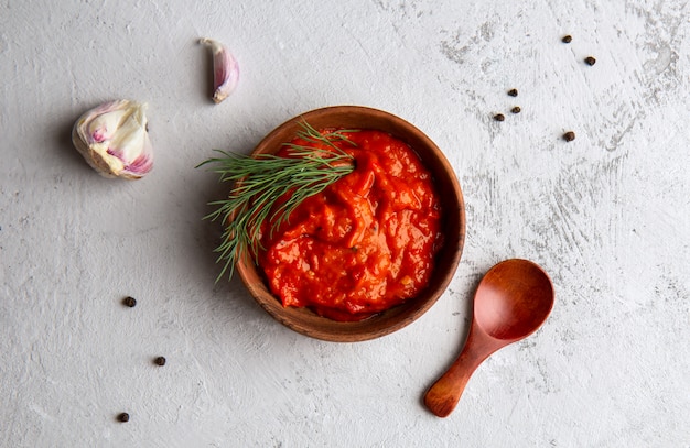 Balkan snack of bell pepper Ajvar on a light space