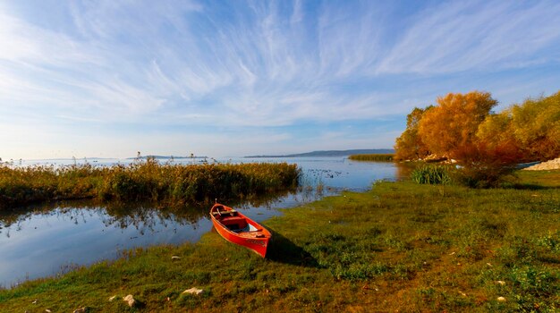 Balkesir Lake Manyas at sunset boats reflection vegetation cloudy sky