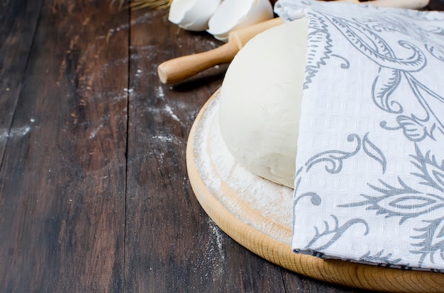 Ball dough , flour in a ceramik bowl