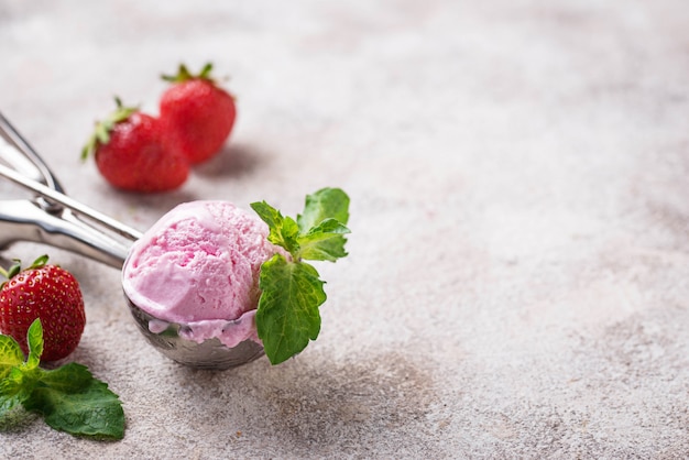 Ball of strawberry Ice cream in scoop