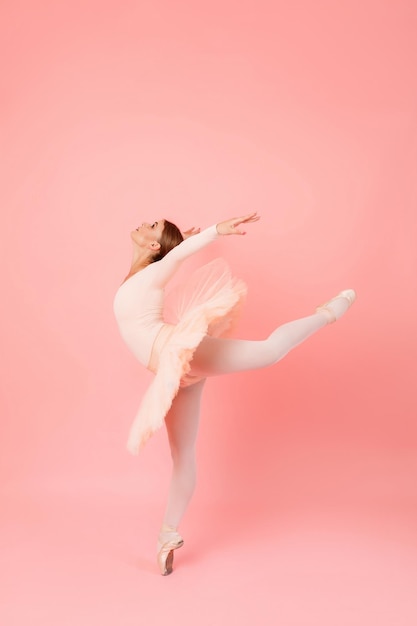 Ballerina bending back in studio