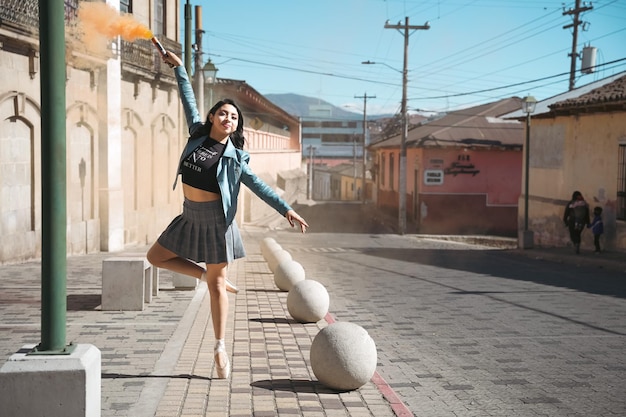 ballet dancer in street wearing skirt and jacket