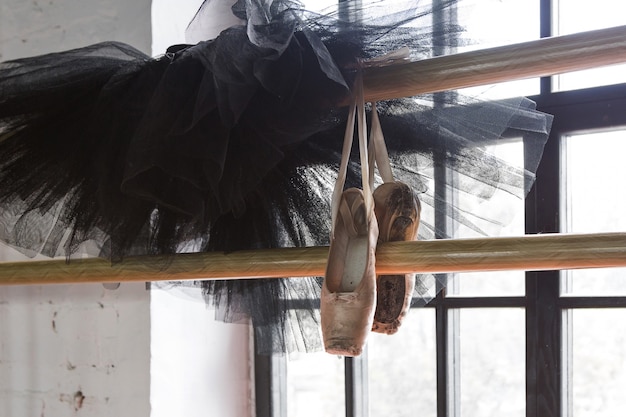 Ballet tutu and pointe shoes in the rehearsal room. Old pointe shoes.