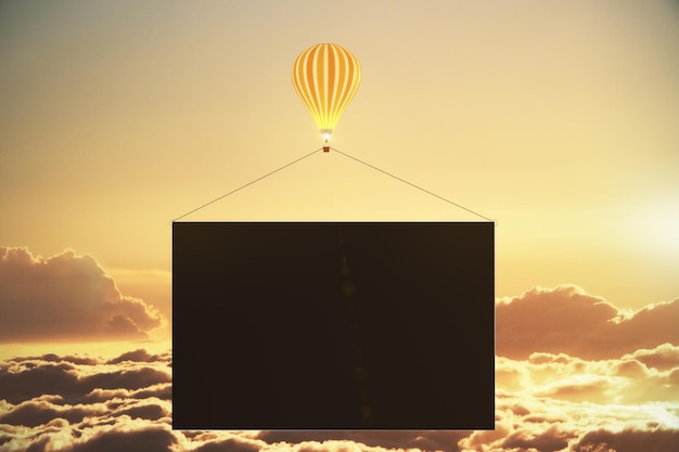 Balloon with black blank advertising banner above the clouds at sunset mock up