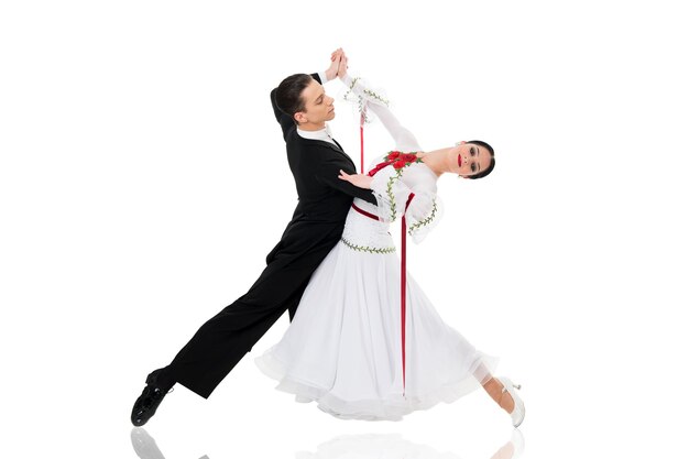 Ballroom couple ballroom dance couple in a dance pose isolated on white background ballroom sensual proffessional dancers dancing walz tango slowfox and quickstep just dance